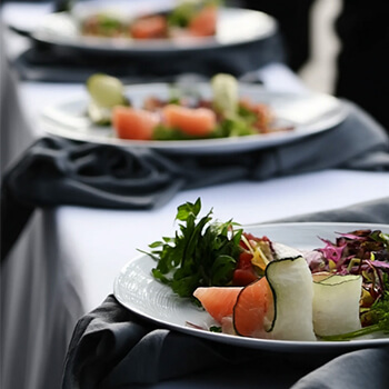 Close-up of gourmet plated appetizer at an elegant catered event.